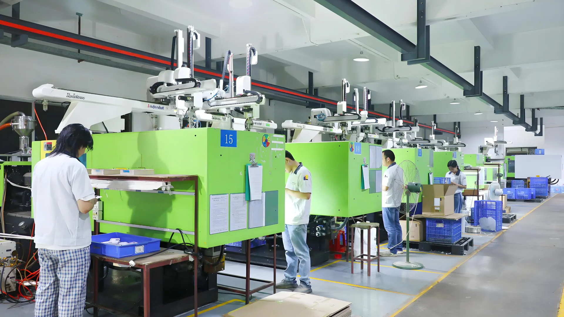 Engineer analyzing data in a modern injection molding facility