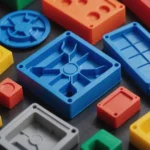 Close-up of multi-color injection molded plastic parts showing common defects.