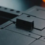 Close-up of an injection molded part with a smooth surface, showing no jet marks.