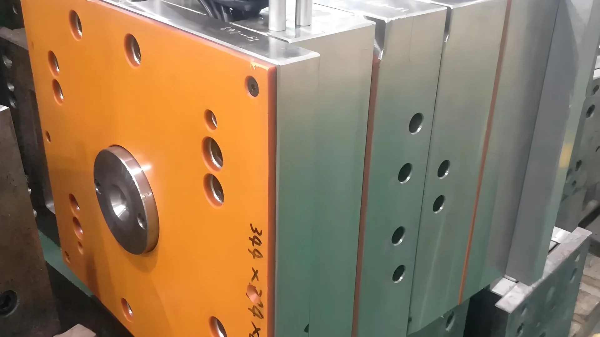 Close-up of a hot runner mold system with molten plastic