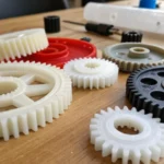 Close-up of various plastic gears on a workbench