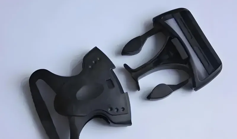 A black plastic 3D printed wrench with two separate pieces shown