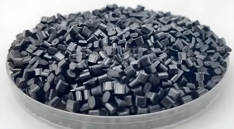 A round container filled with small black plastic pellets