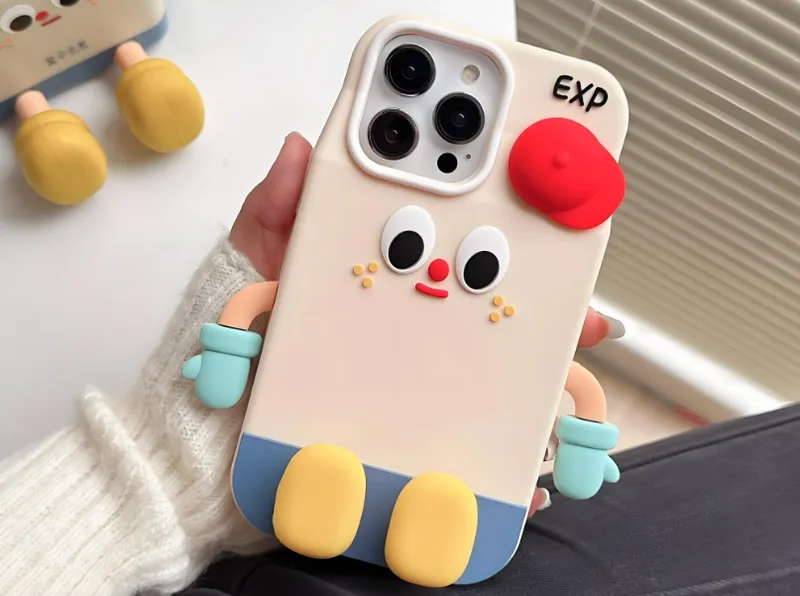 A phone case featuring a cartoon character design with arms, legs, and facial features