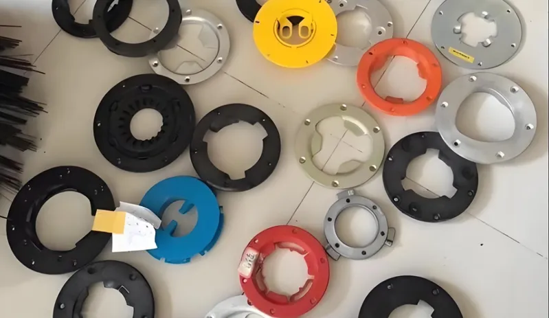 A collection of colorful circular gears and discs on a white surface