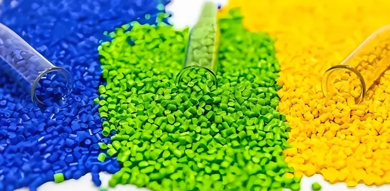 Blue, green, and yellow plastic pellets with test tubes