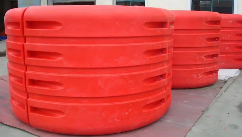 Red plastic tank barriers stacked together