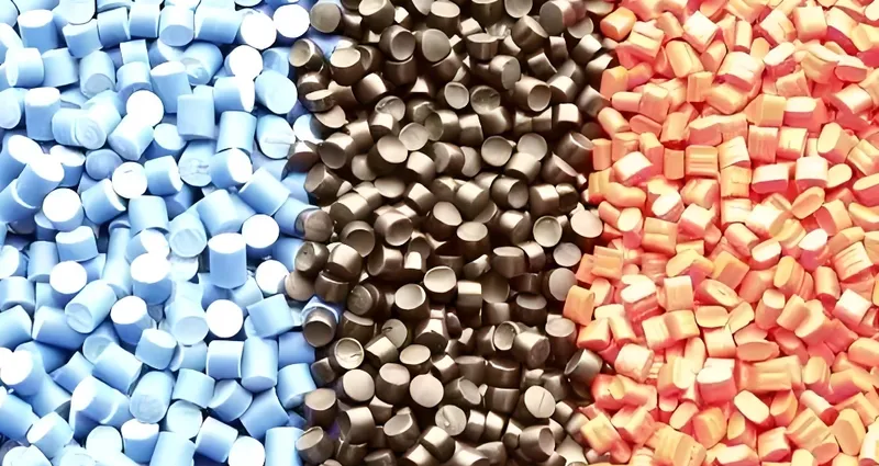 Blue, black, and red plastic pellets arranged in three vertical sections