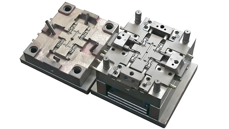 A detailed view of a precision metal mold used in manufacturing