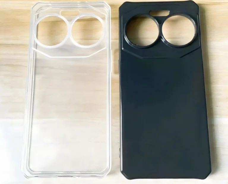 Two phone cases with large camera cutouts, one clear and one black, on a wooden surface.