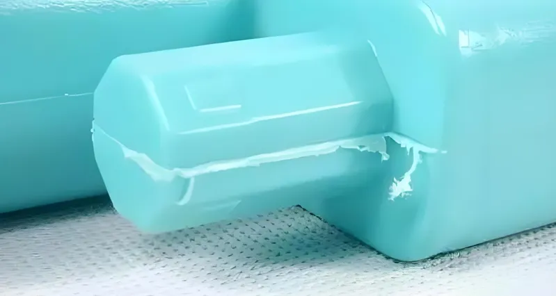 A close-up view of a light blue colored toothpaste