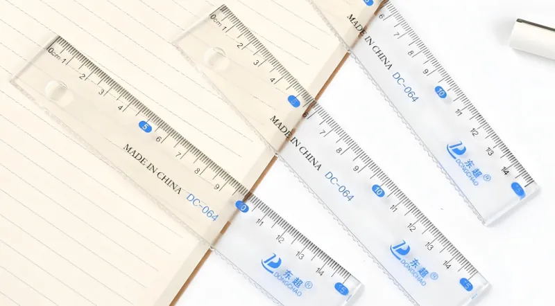 Transparent plastic rulers on a lined notebook