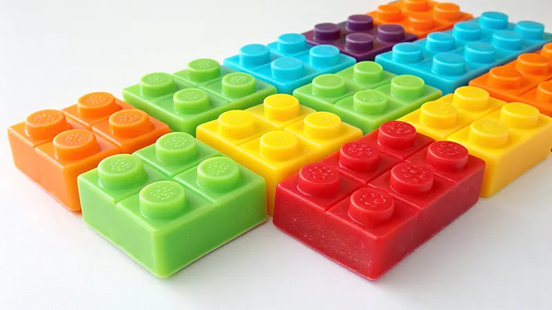 Multiple colorful soap bars shaped like building blocks arranged in rows