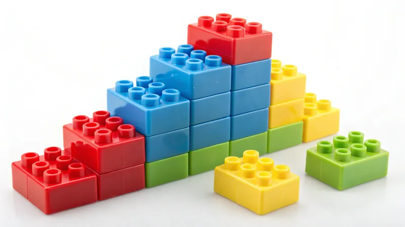Stacked red, blue, yellow, and green toy building blocks