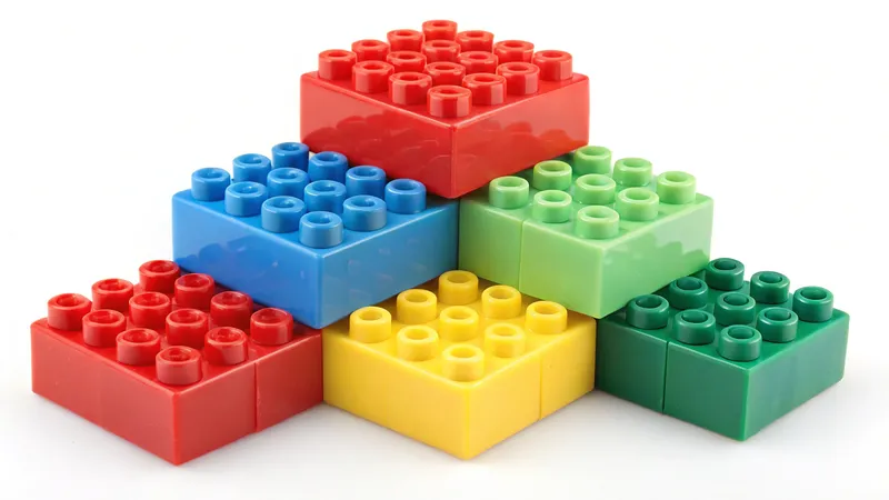 A stack of colorful Lego bricks arranged in a pyramid shape